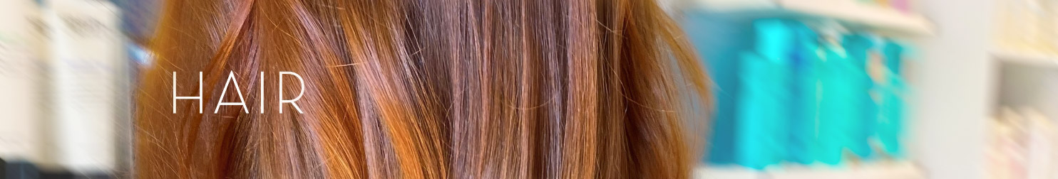close-up of brown hair with coloring brush